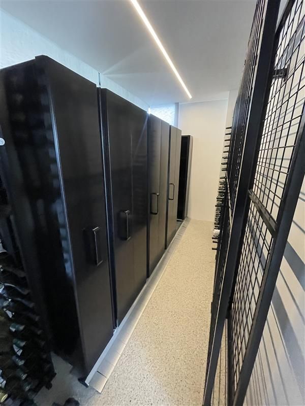 A Man Is Driving A Forklift — Shop Fittings Office Furniture Materials Handling In Gosford, NSW