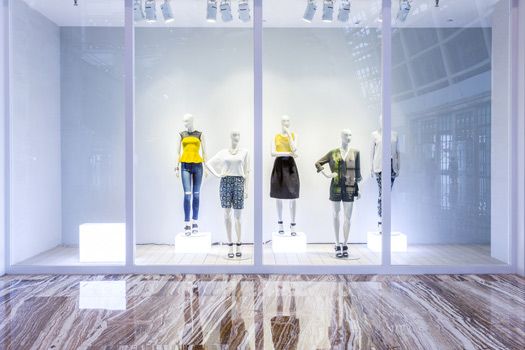 A Blurred Image Of A Store Window With Mannequins In It — Shop Fittings Office Furniture Materials Handling In Gosford, NSW