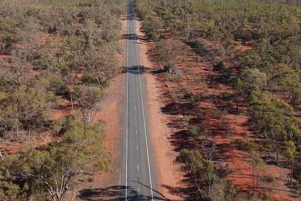 An Aerial View Of A Road In The Middle Of A Desert Surrounded By Trees — Shop Fittings Office Furniture Materials Handling In Silverwater, NSW