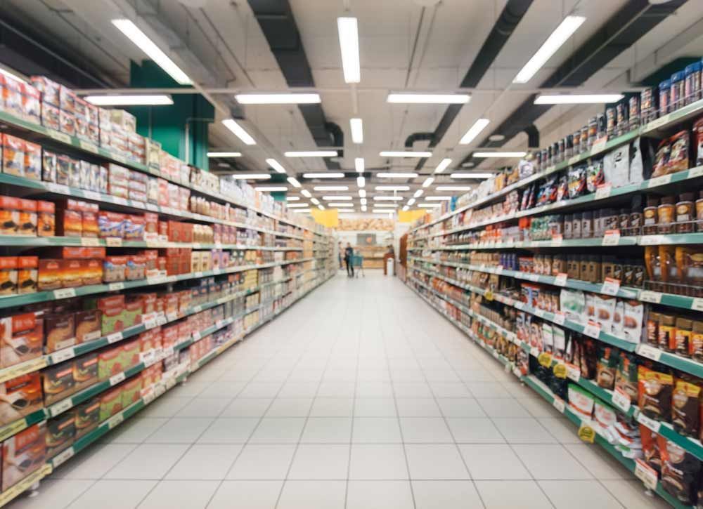 A Supermarket Aisle Filled With Lots Of Products — Shop Fittings Office Furniture Materials Handling In Gosford, NSW