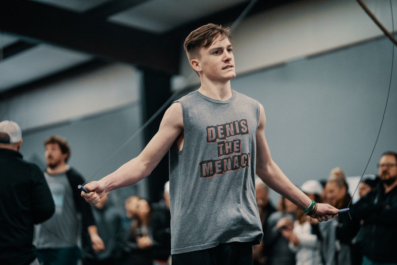 Man skipping rope, wearing a tank top that reads 