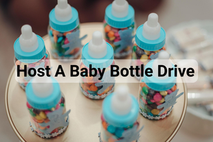 A person is holding a white box that says `` donate ''.