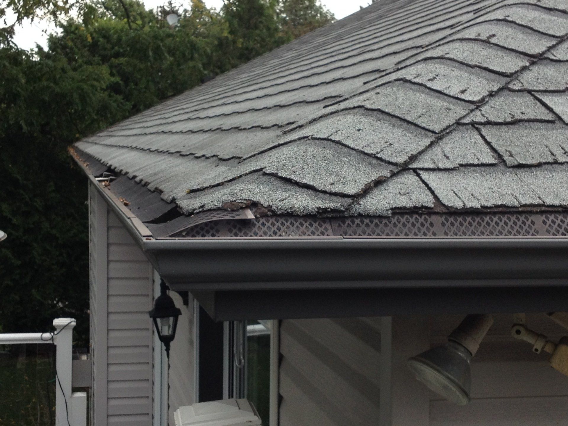 A house with a roof that is missing shingles