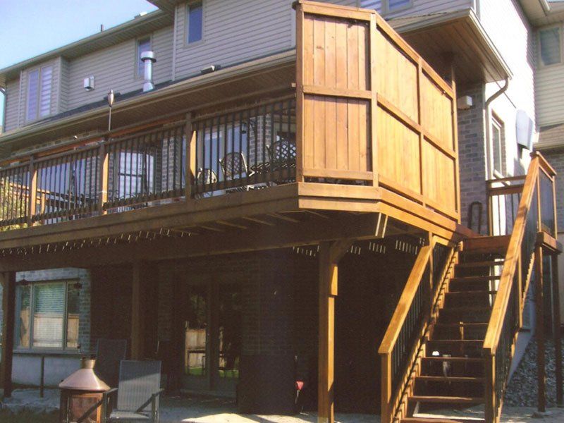 A wooden deck with stairs leading up to it