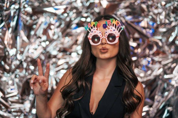 Woman wearing Happy Birthday glasses