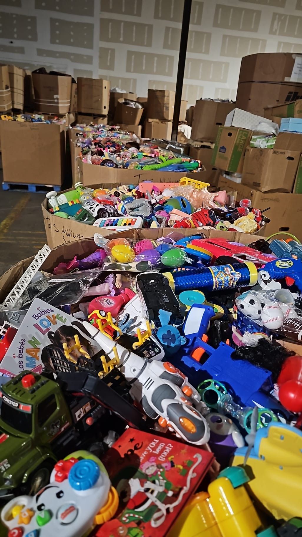 A warehouse filled with lots of toys and boxes.