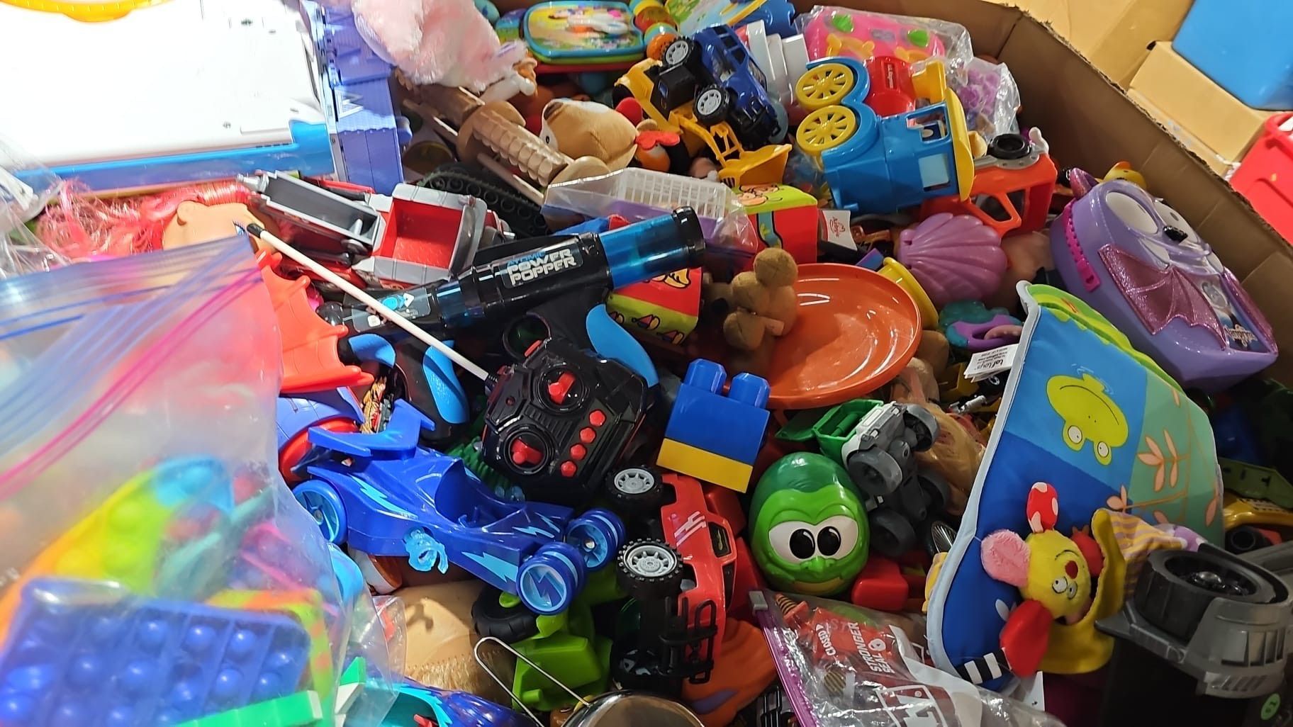 A box filled with lots of colorful toys.