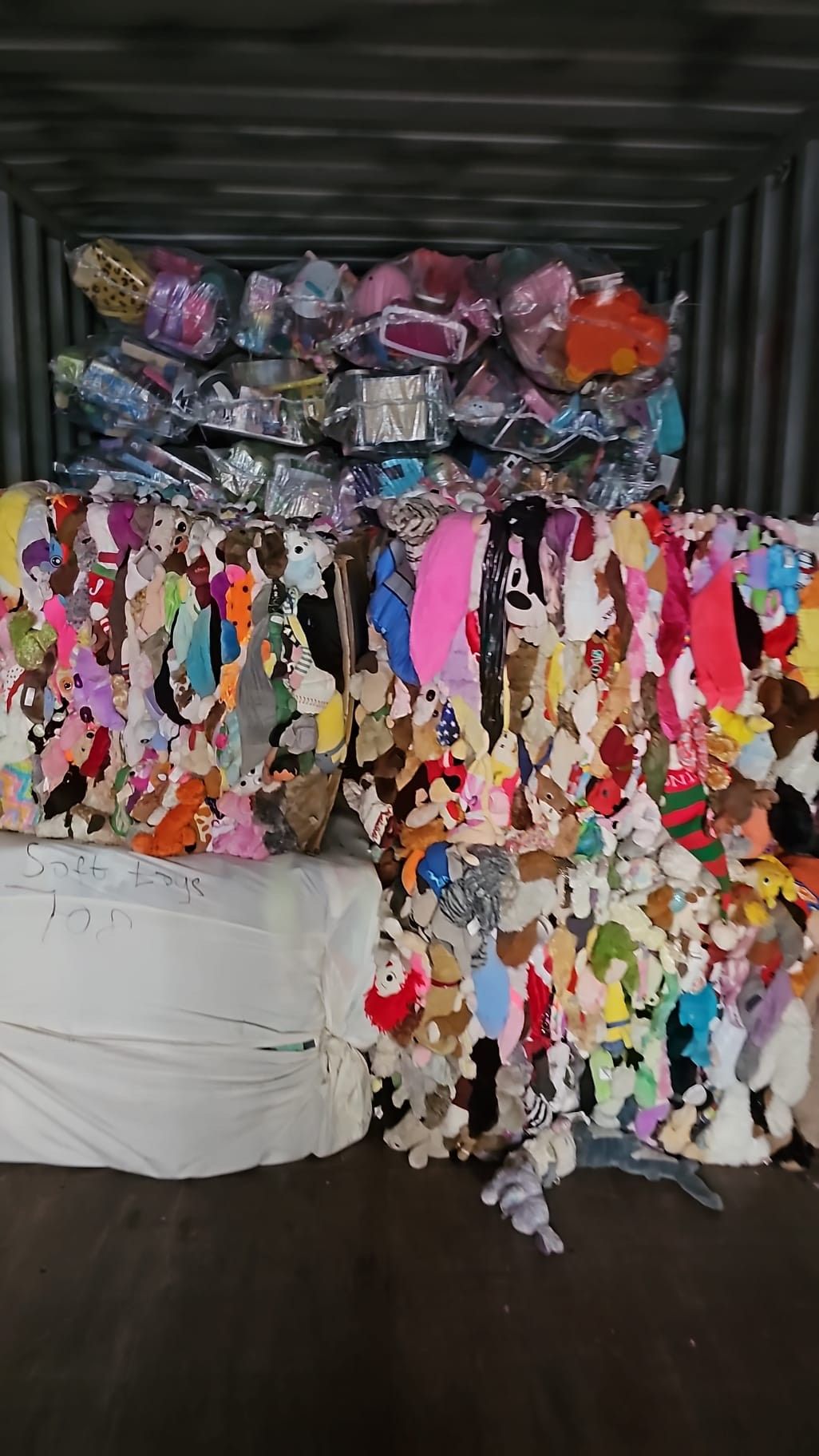 A pile of stuffed animals sitting on top of each other on a table.