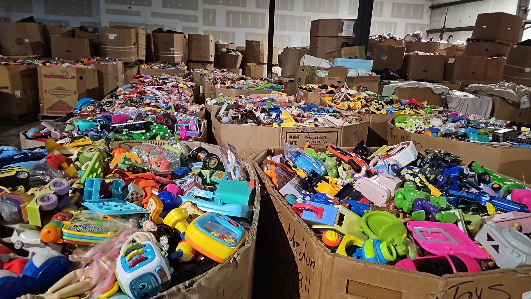 A warehouse filled with lots of toys and boxes.