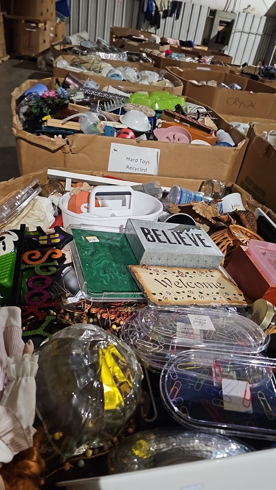 A warehouse filled with lots of boxes filled with various items.