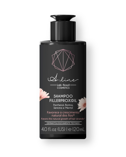 Una botella de champú negra con una flor rosa encima.