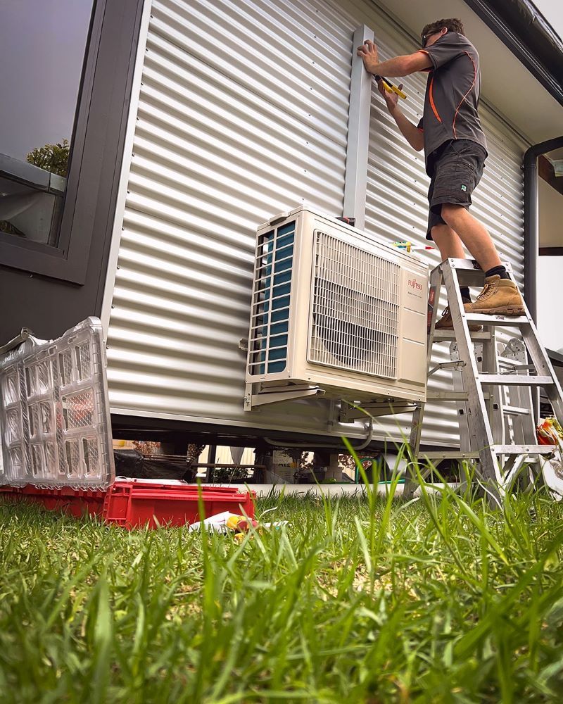 Technician installing an aircon
