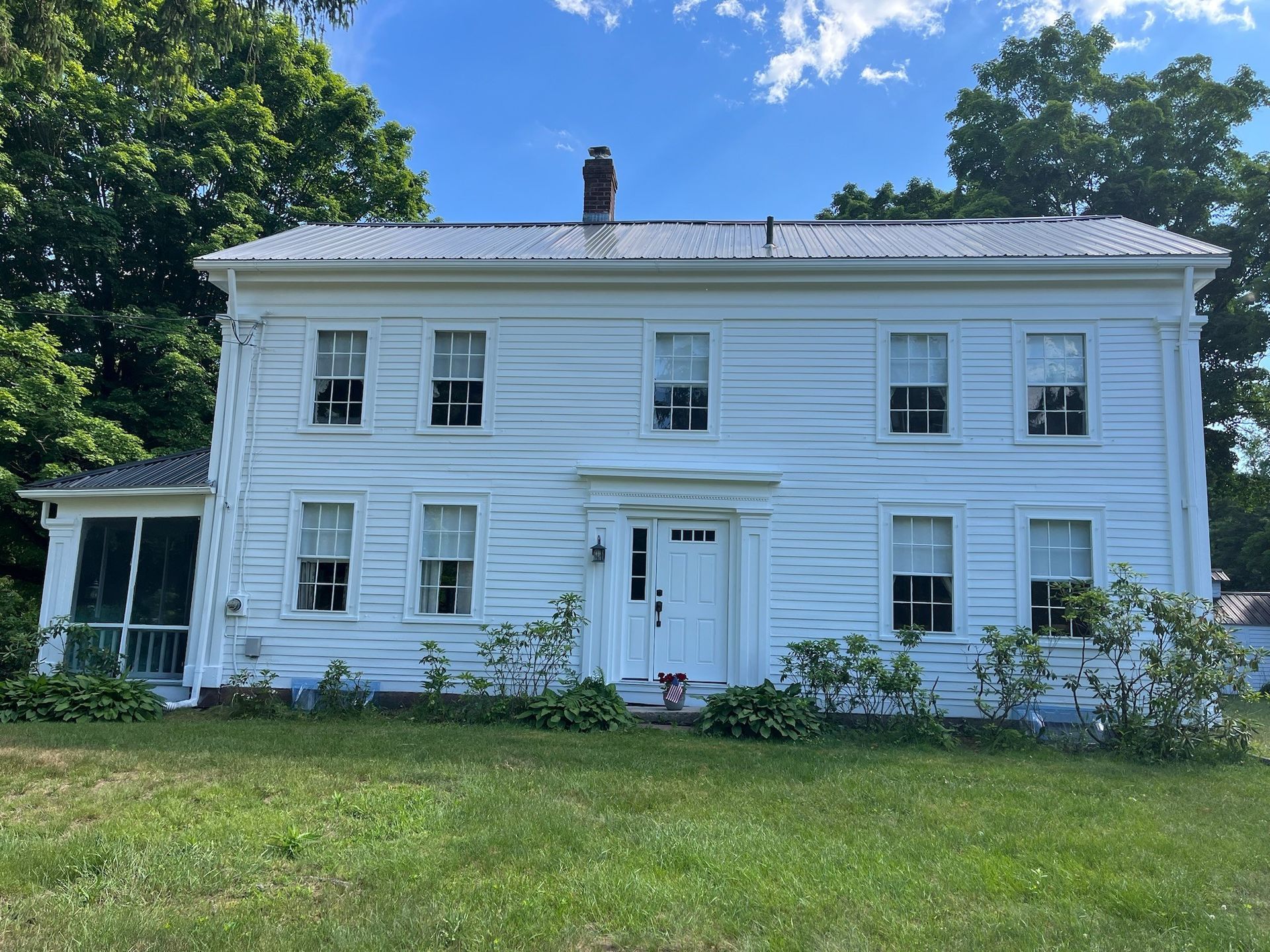 Exterior home painted white by Pioneer Painters in Western MA