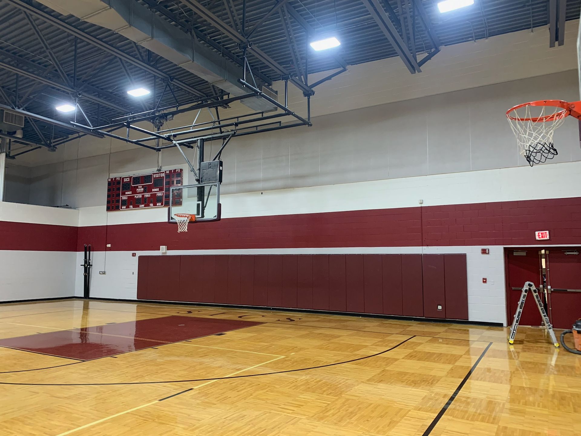 Painting a gymnasium at a local school in Western Massachusetts.