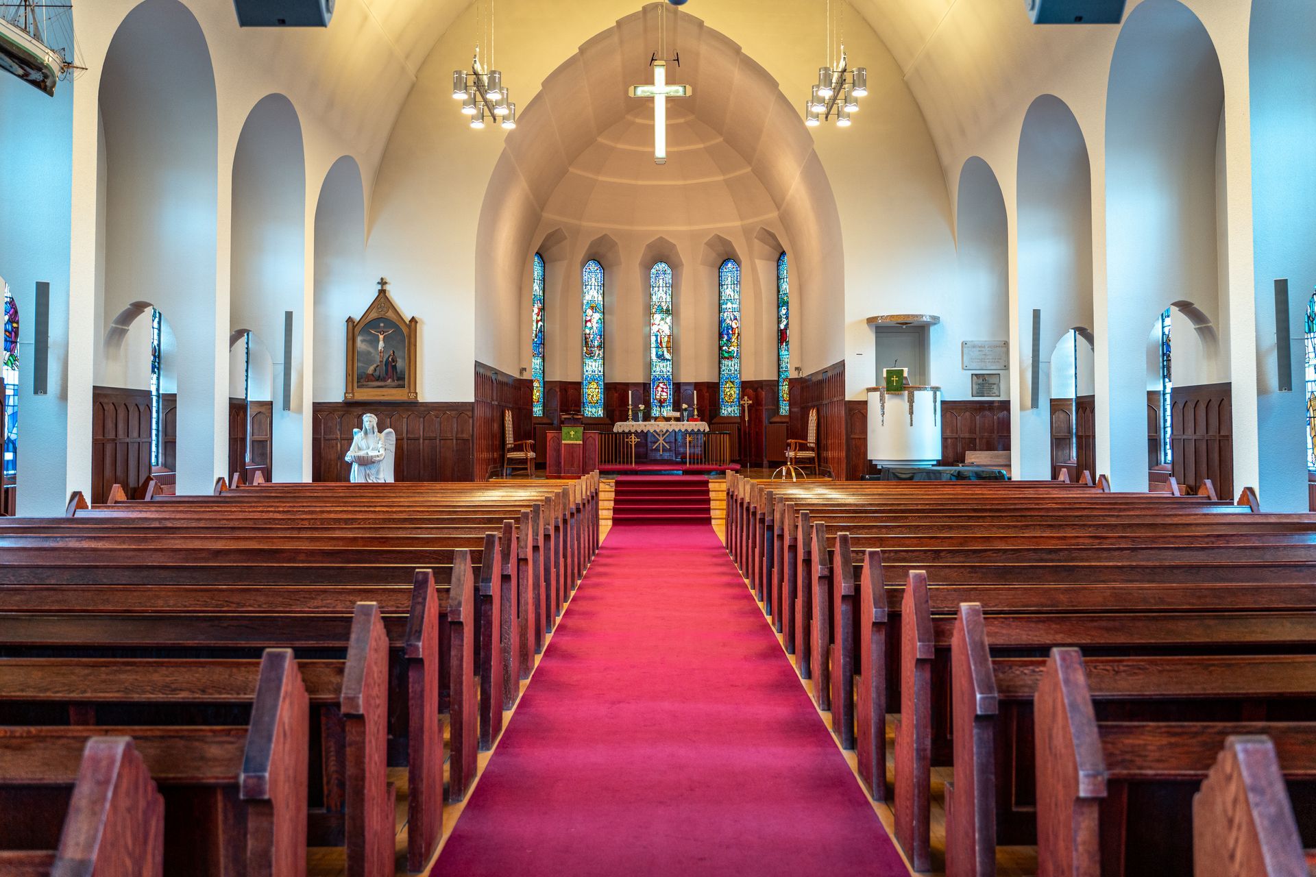 interior of a church after ceiling being painted and pews being painted