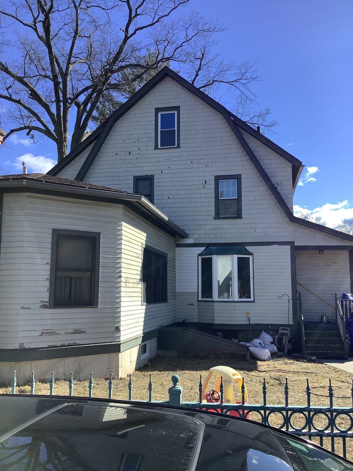 exterior home paint is peeling off and house prior to exterior paint