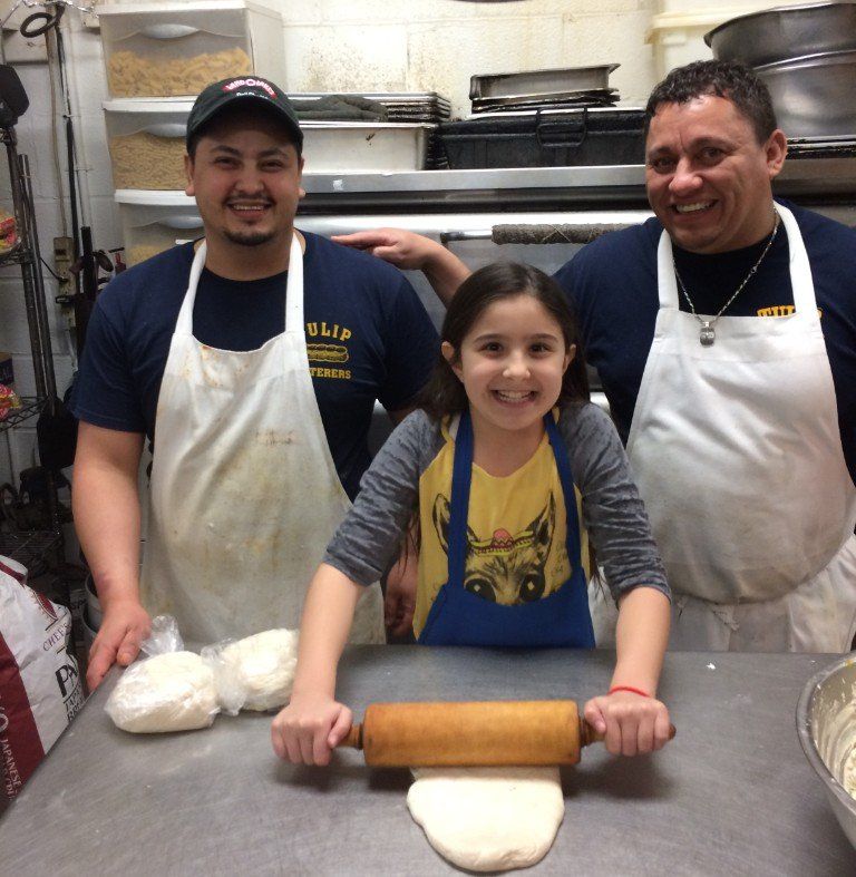 crew rolling dough