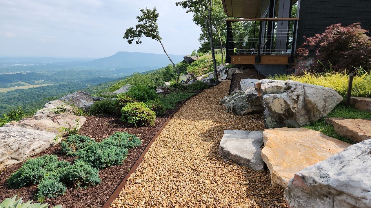 A house on top of a hill with a view of a valley