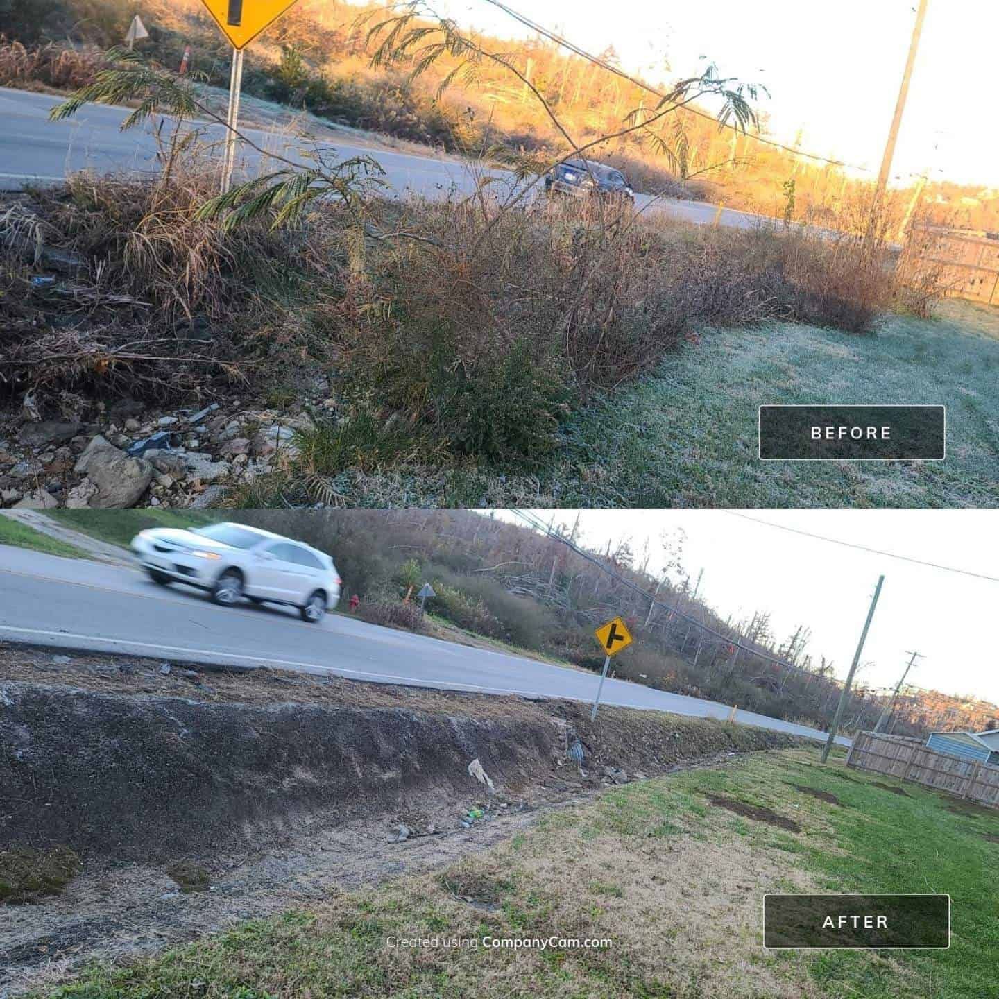 A white car is driving down a road next to a yellow sign