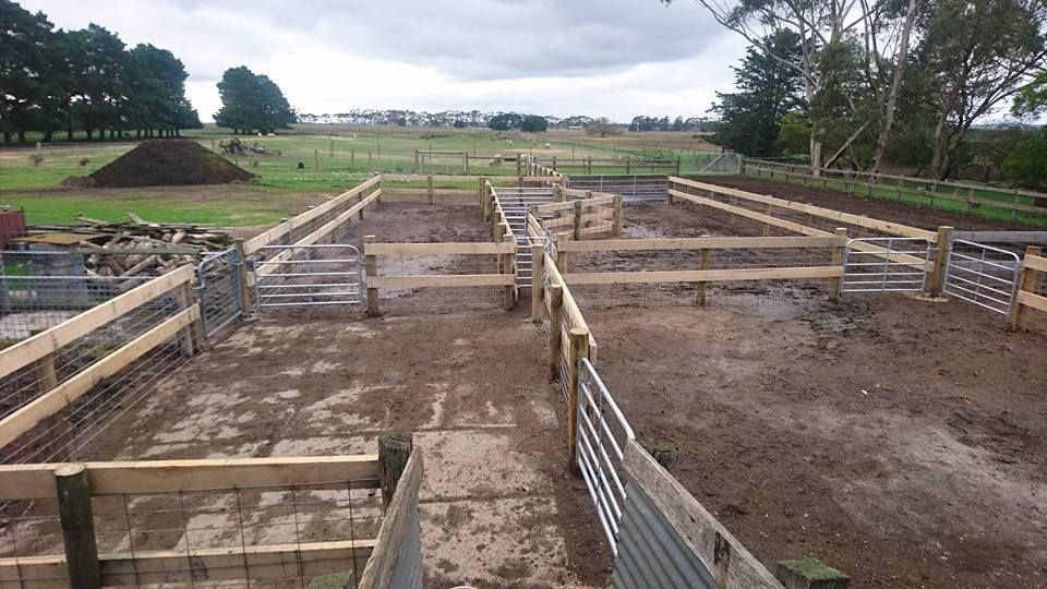 A Wooden Fence is Surrounding a Dirt Field — Ettles Rural Fencing in Alfredton, VIC