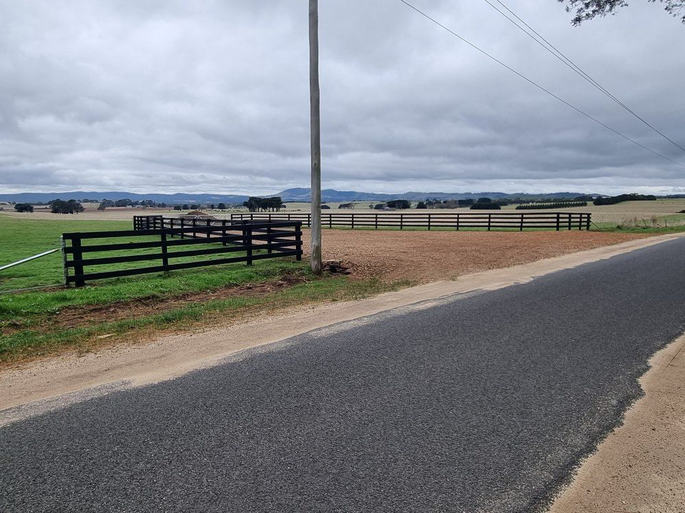 A Dirt Road With a Fence on the Side of It — Ettles Rural Fencing in Alfredton, VIC