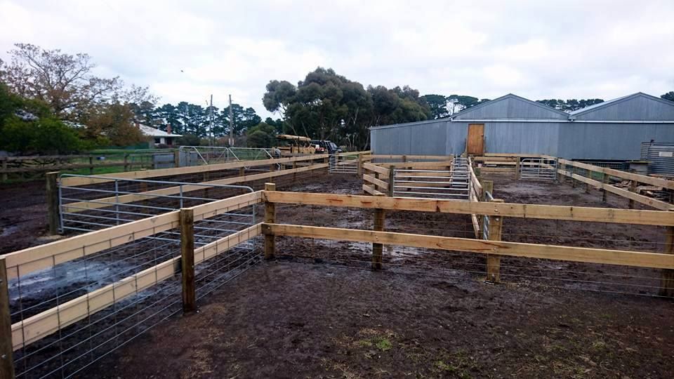 A dirt road leading to a house with a wooden fence— Ettles Rural Fencing in Alfredton, VIC