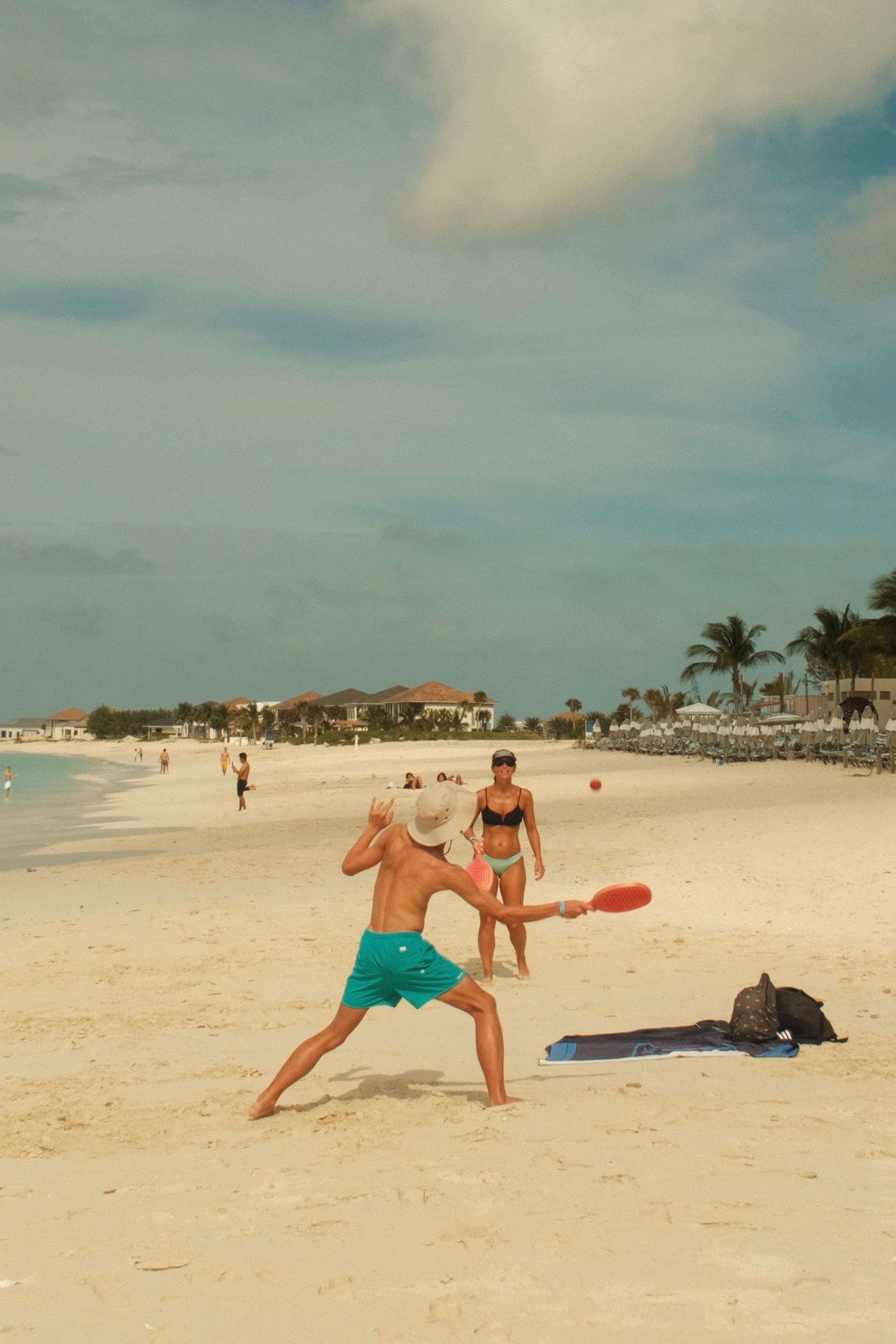 Family with kids in the calm shallow lagoon at Blue Lagoon Island near Nassau