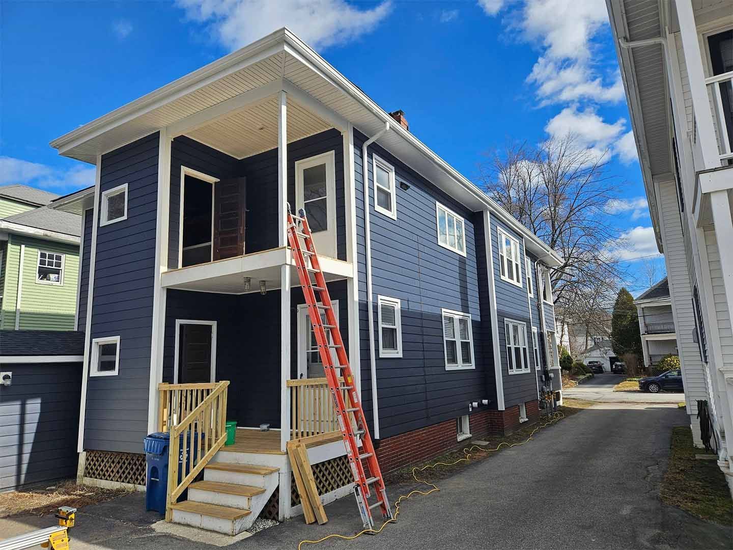 A house with a lot of siding on it is being built.