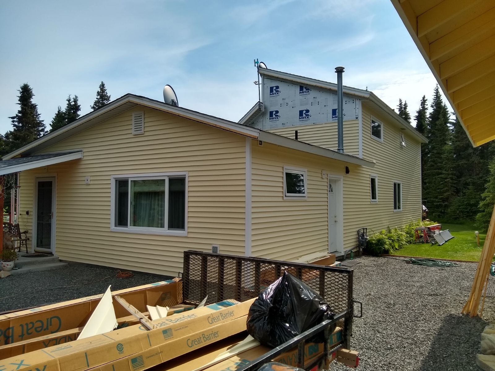 A house with a lot of siding on it is being built.