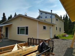 A house with a lot of siding on it is being built.