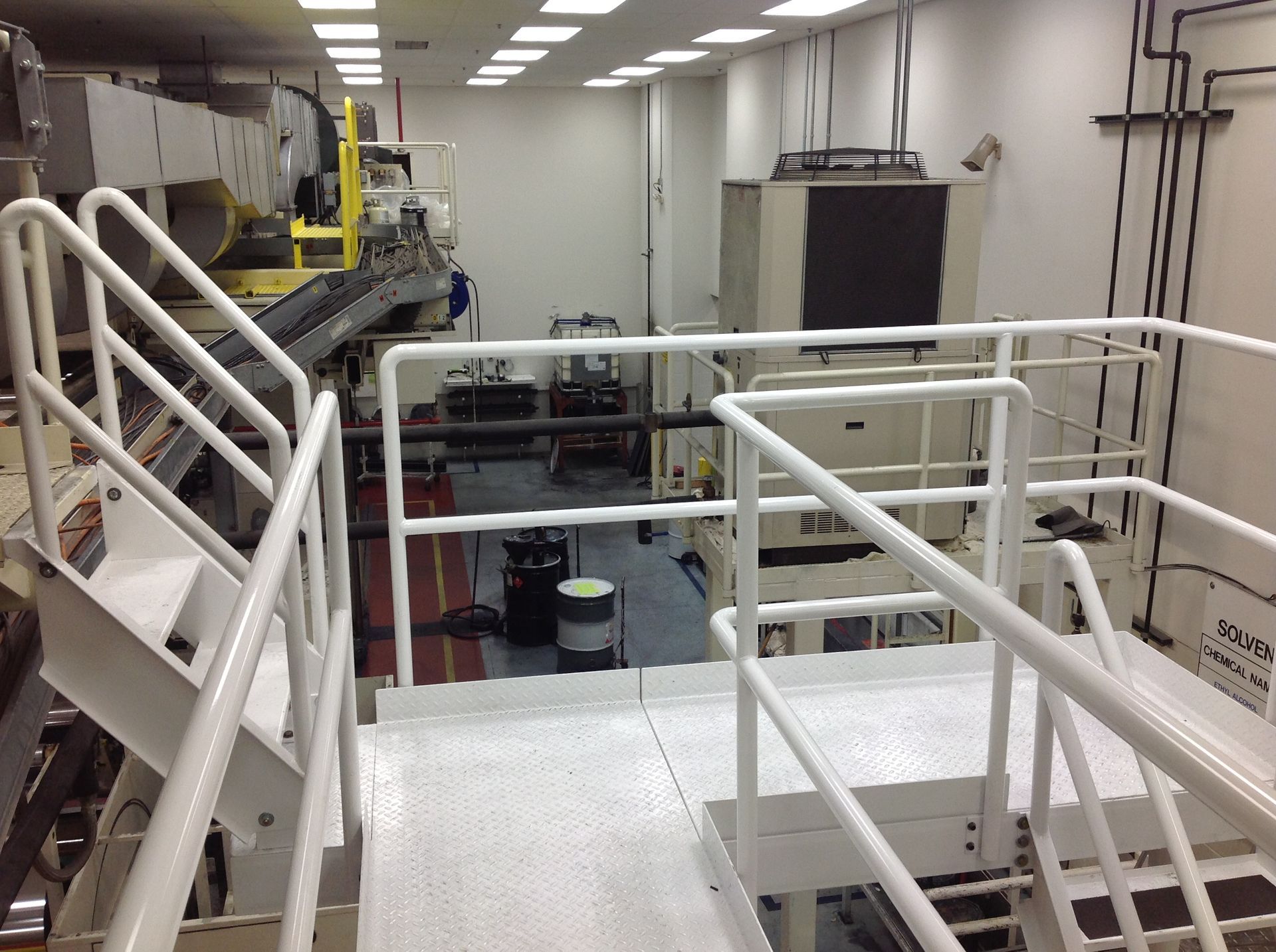 A building under construction with a lot of balconies and railings