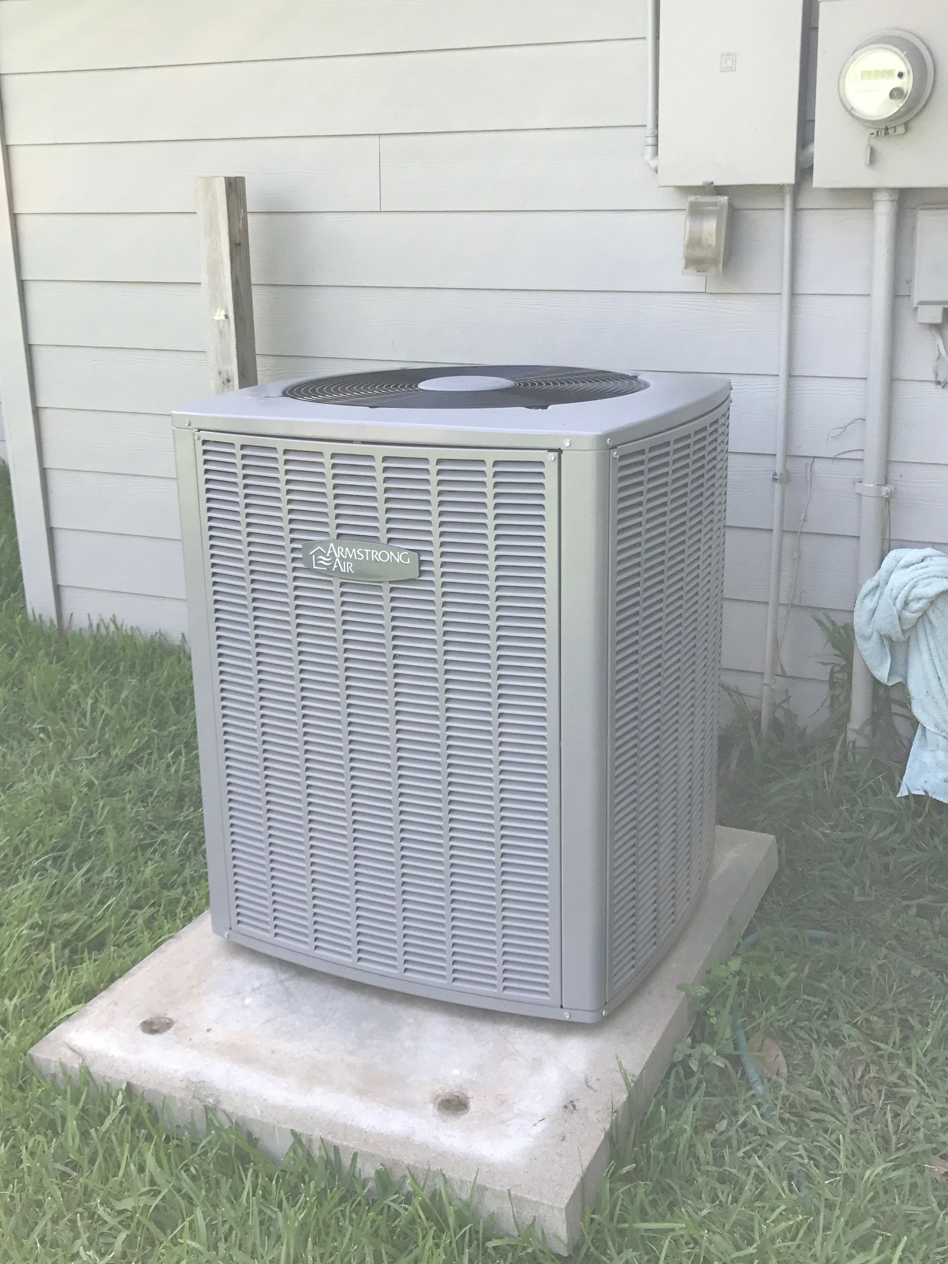 Air conditioner unit outside of a house.