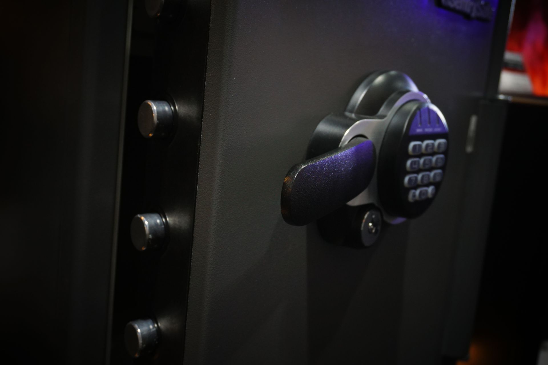 A close up of a digital lock on a safe.