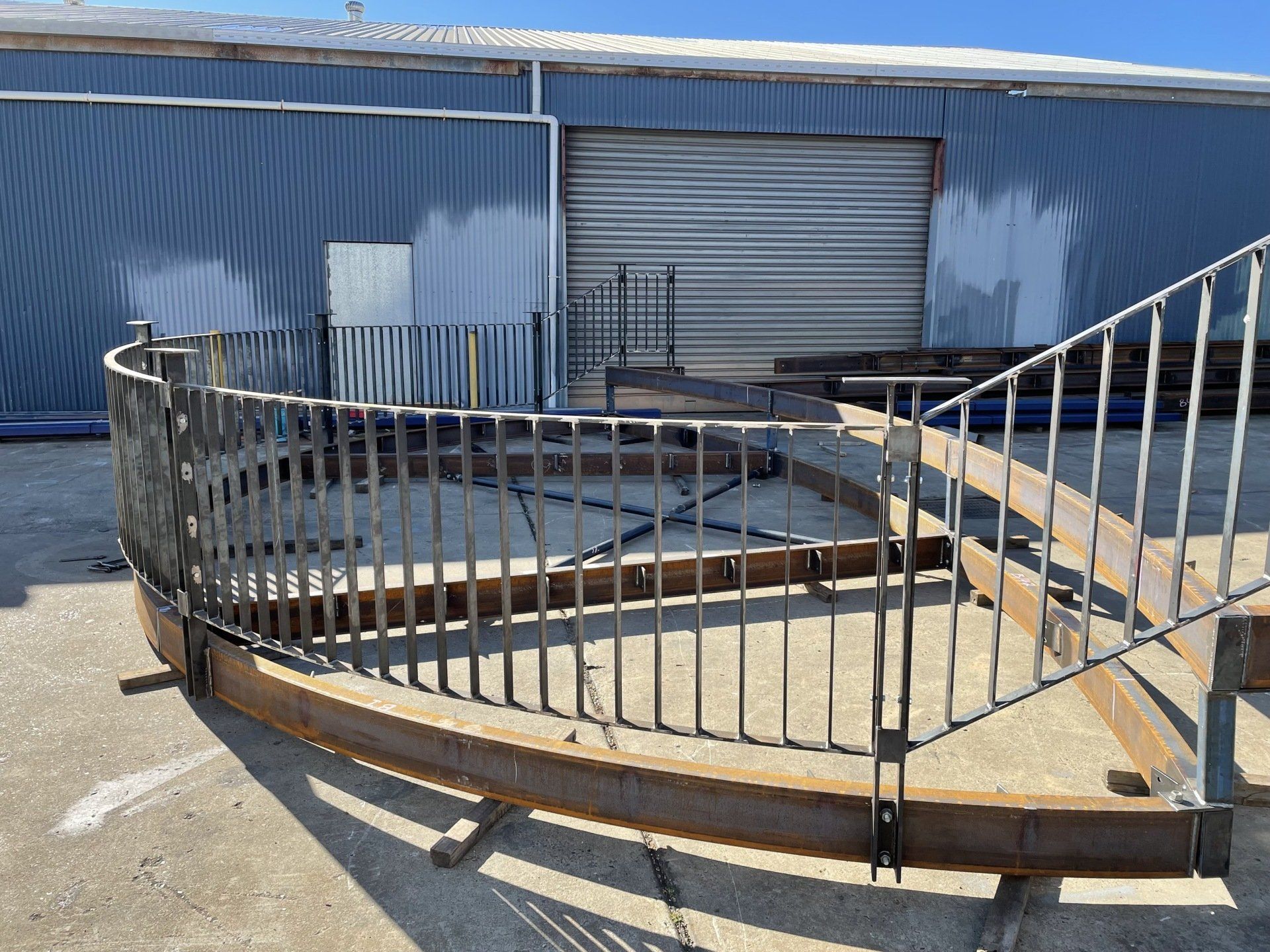 A metal fence is sitting in front of a building.