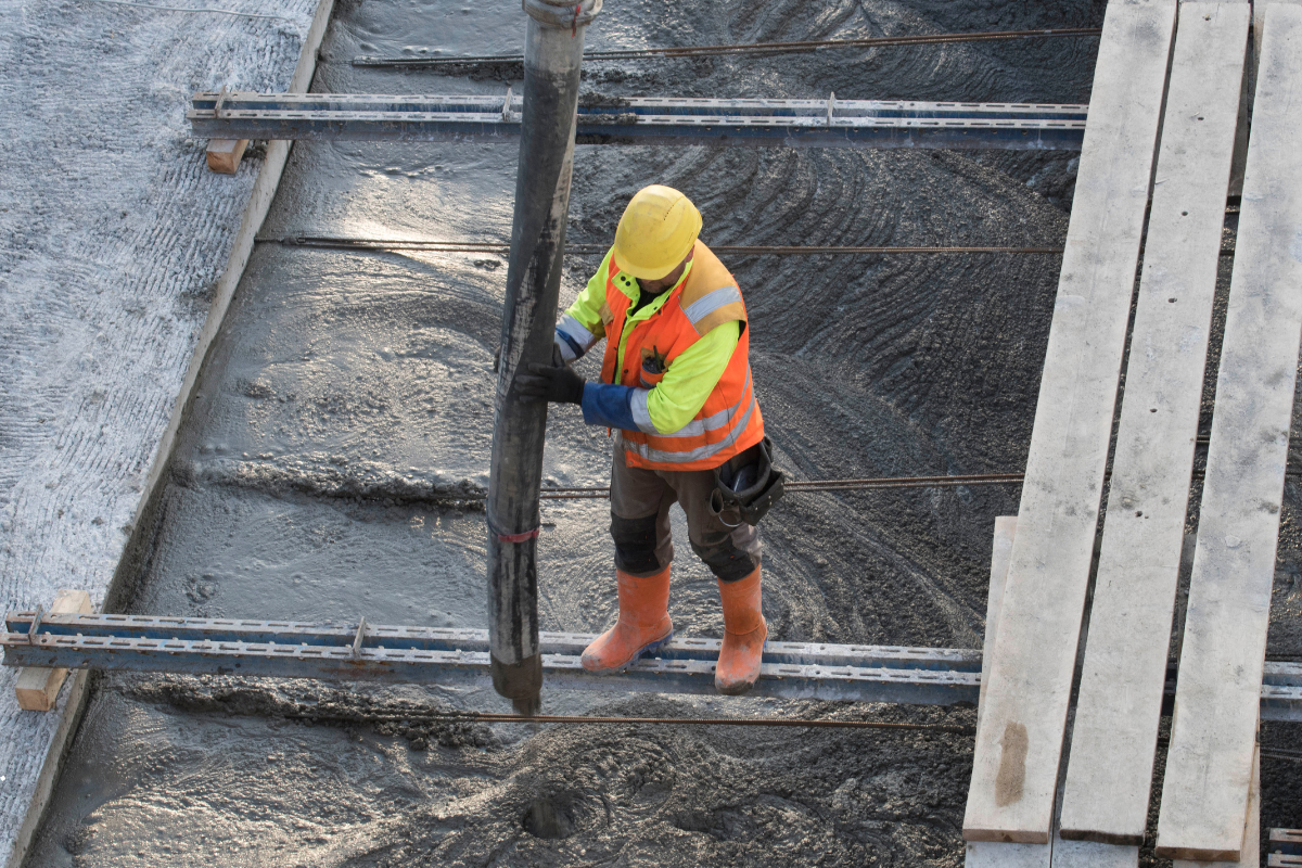 Worker applying crystallisation system for concrete waterproofing