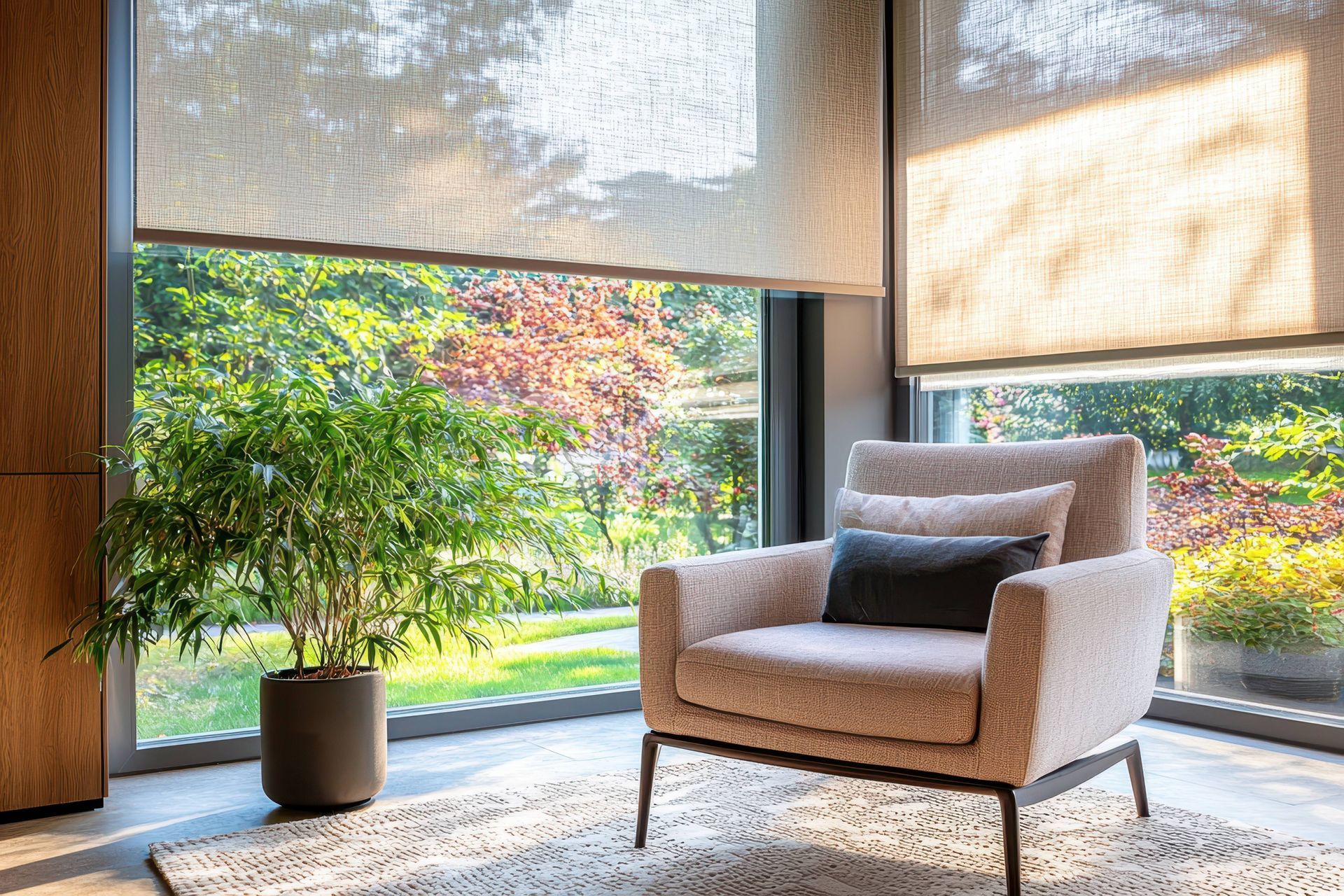 Modern living room with solar shades, accent chair, and potted plant near Atlanta, Georgia (GA)