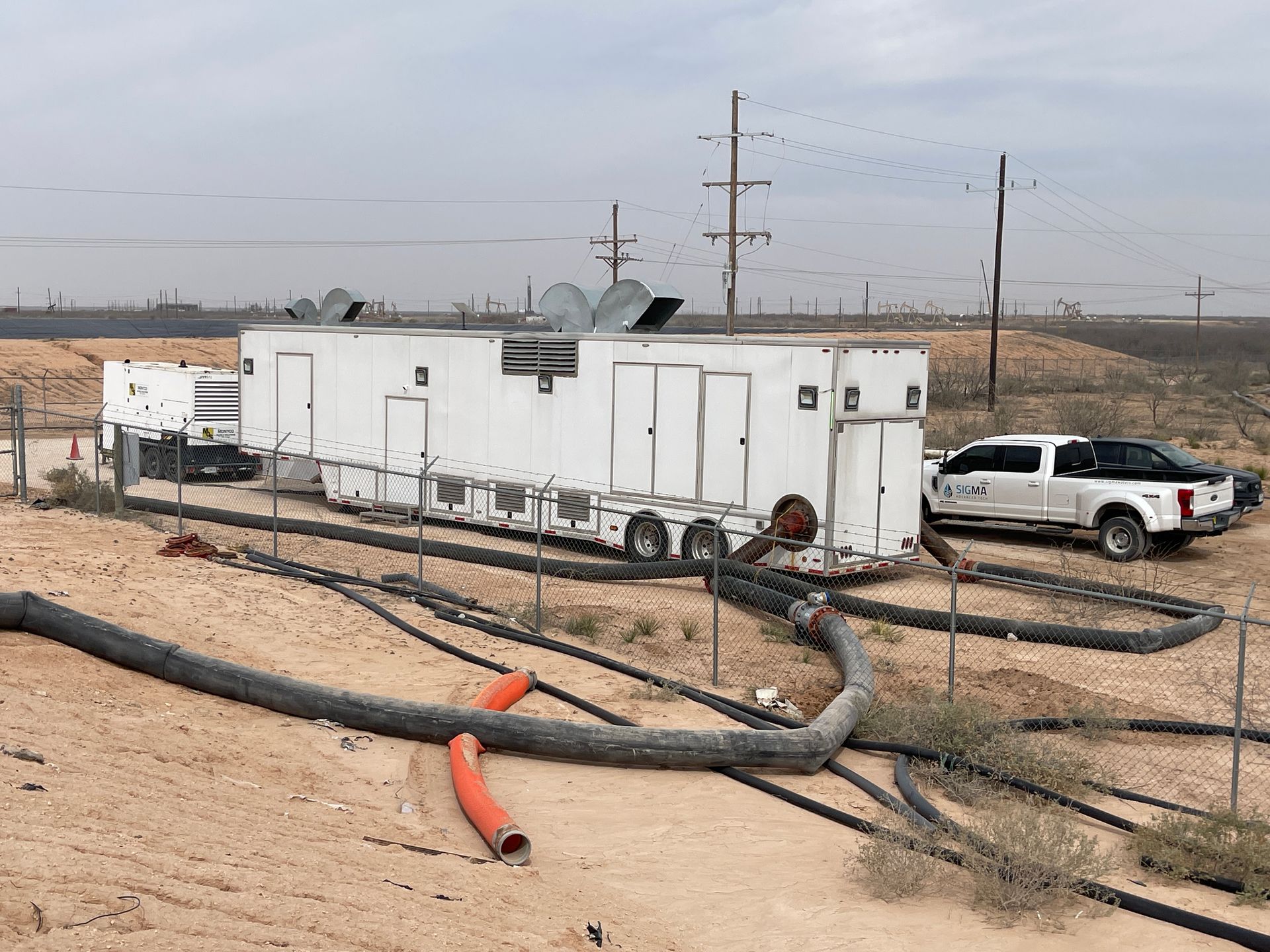 a bunch of pipes in a factory with one that says ' stainless steel ' on it