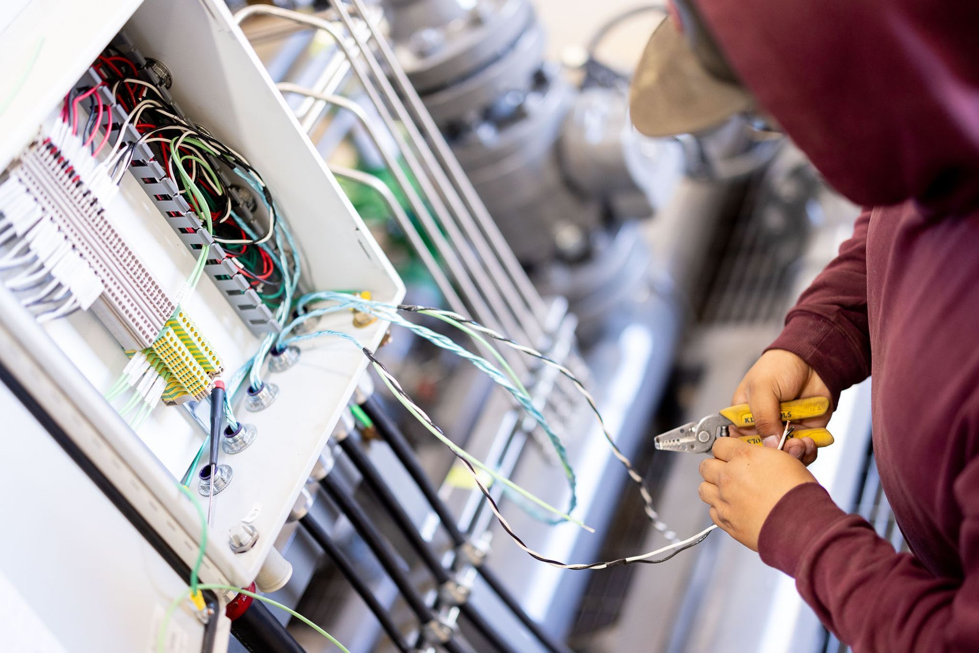 a PESCO employee is working on a fan-doo machine