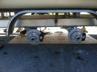 Factory replacement 3500 lb. torsion axles and brake calipers installed