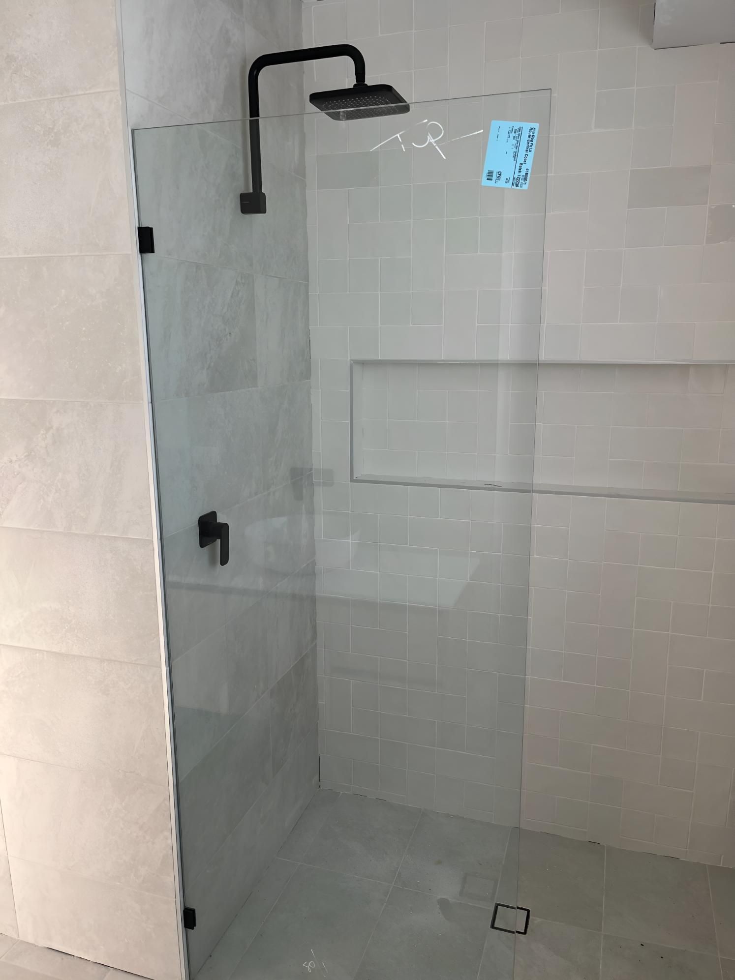 Bathroom With a Glass Shower Door — TM Built Construction In Branxton, NSW