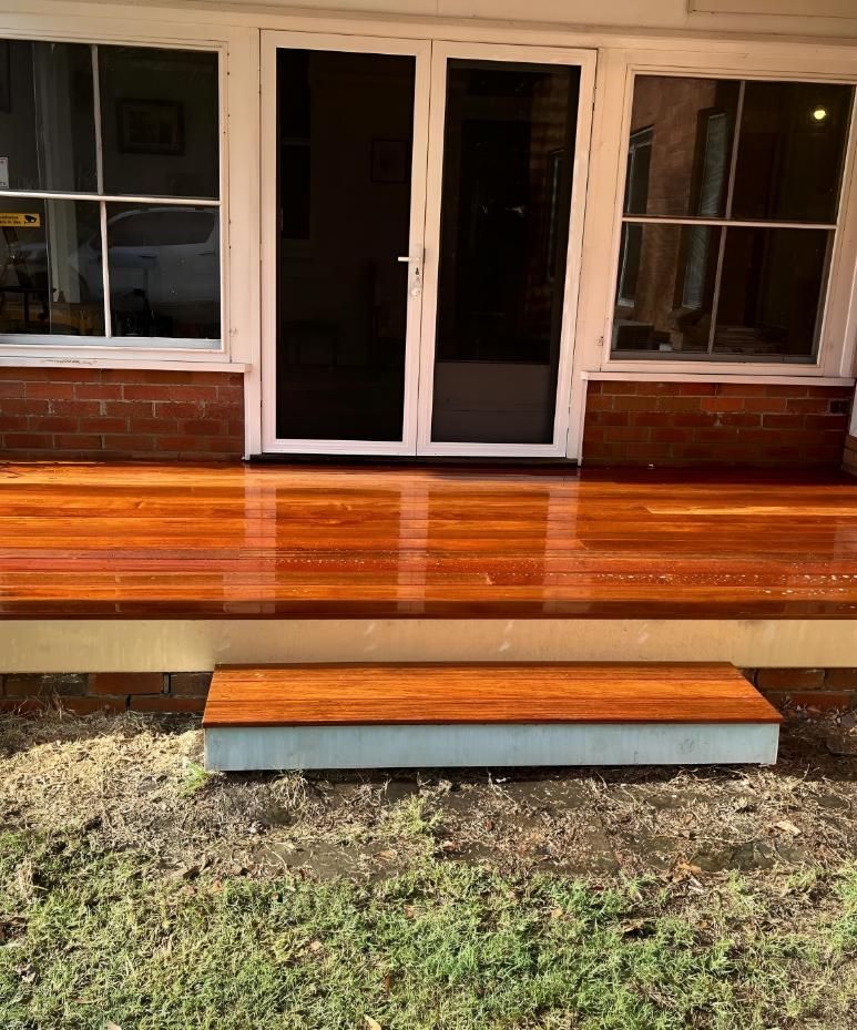 Wooden Deck is Sitting in Front of a Brick House — TM Built Construction In Branxton, NSW