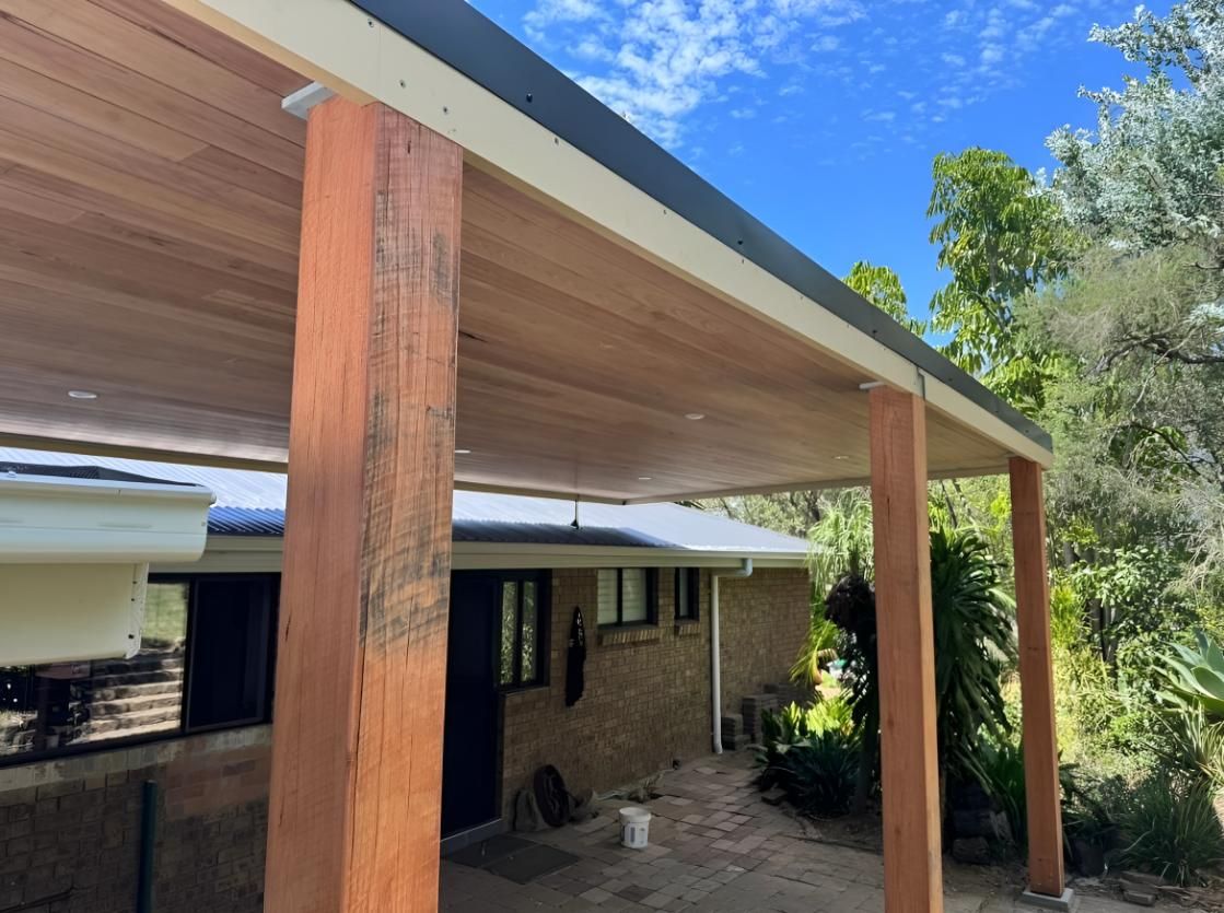 House With a Wooden Porch and a Blue Sky — TM Built Construction In Branxton, NSW