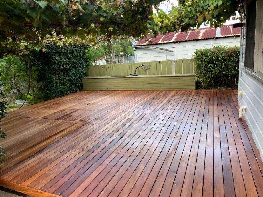 Large Wooden Deck With a Fence in the Background — TM Built Construction In Cessnock, NSW
