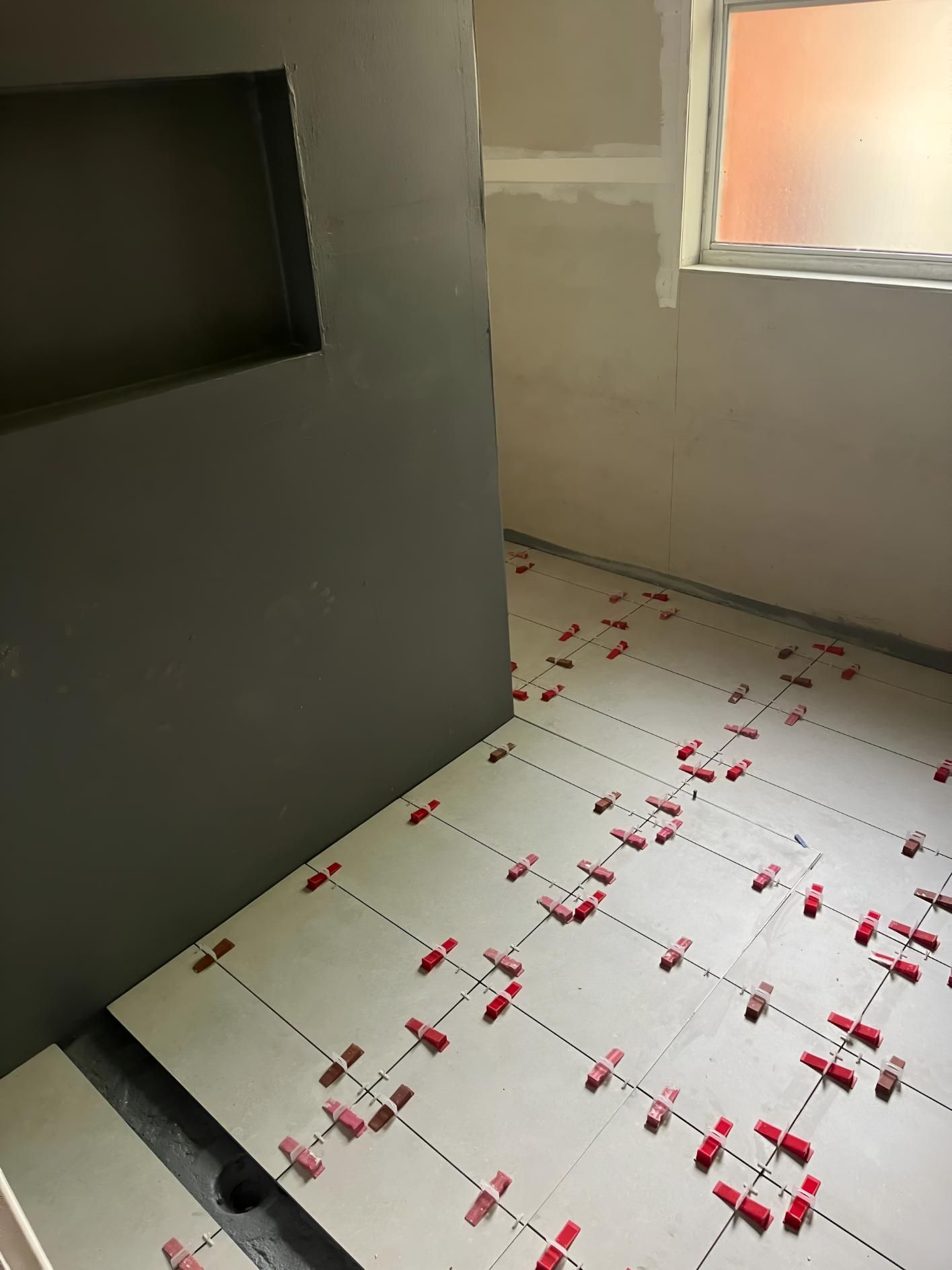 Room With a Lot of Tiles on the Floor and a Window — TM Built Construction In Branxton, NSW