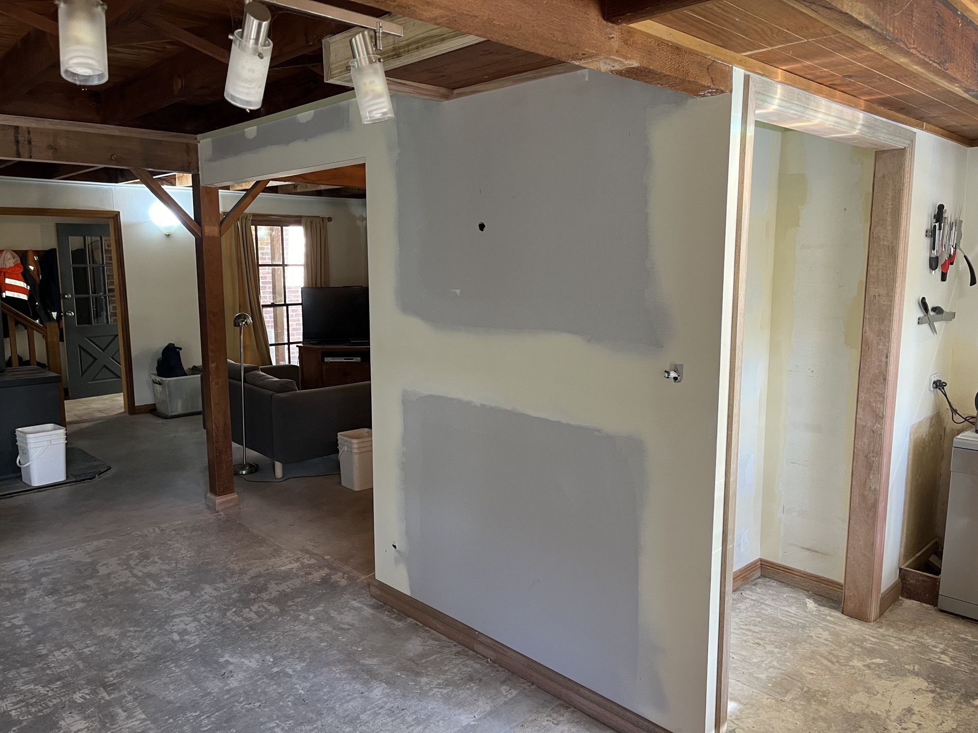 Room With a Couch and a Television in It — TM Built Construction In Lochinvar, NSW