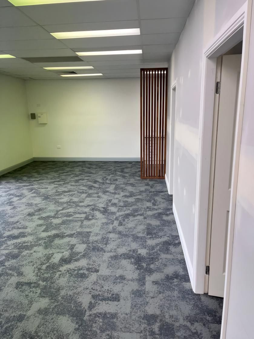 Empty Room With a Carpeted Floor and White Walls — TM Built Construction In Singleton, NSW