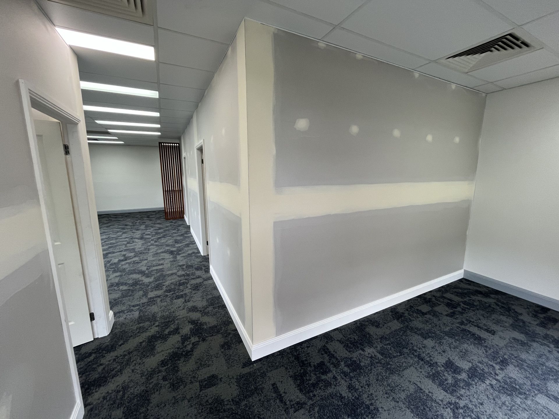 Empty Room With a Carpeted Floor — TM Built Construction In Rutherford, NSW