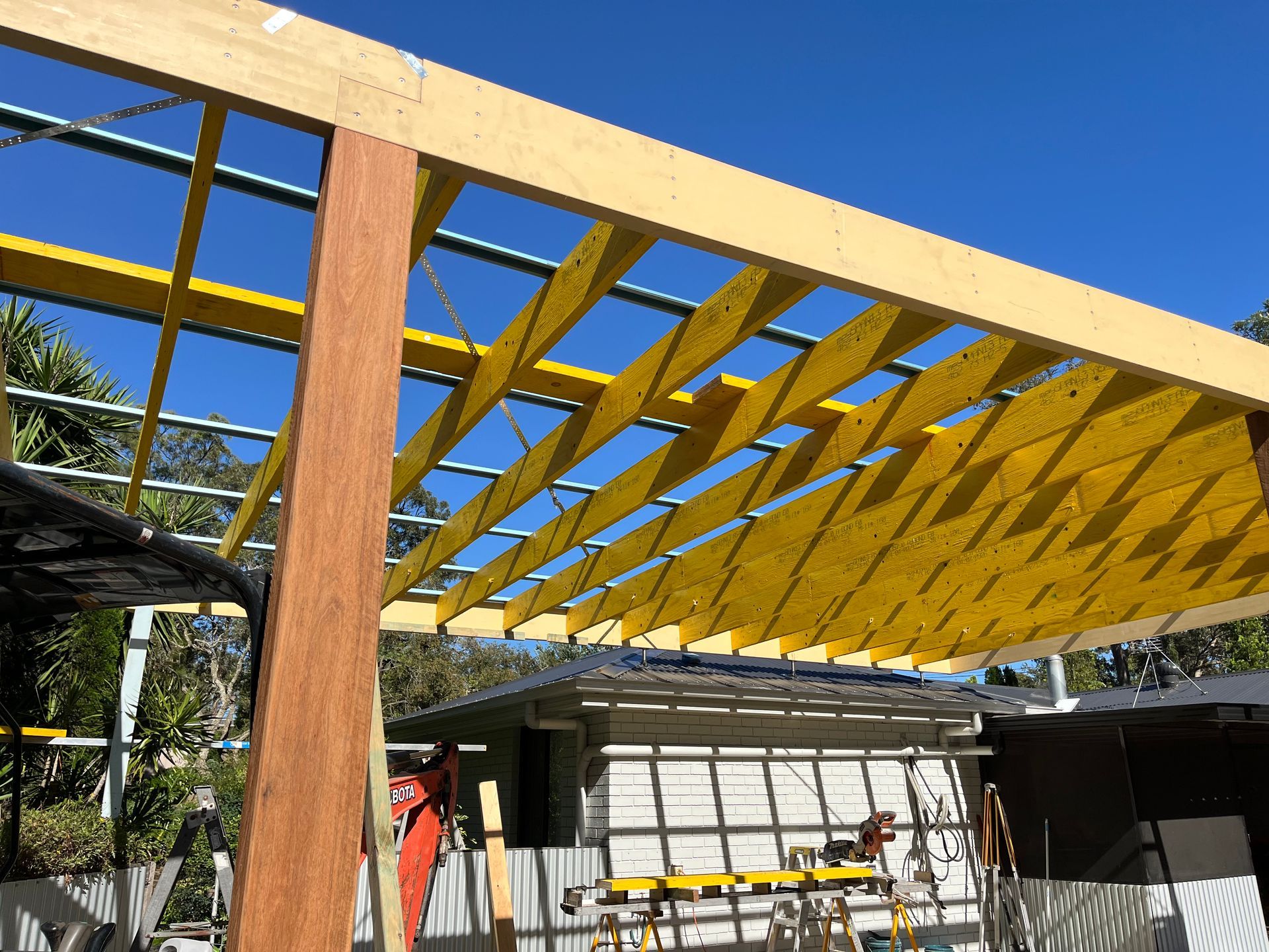 A wooden structure is being built with a blue sky in the background — TM Built Construction In Lochinvar, NSW