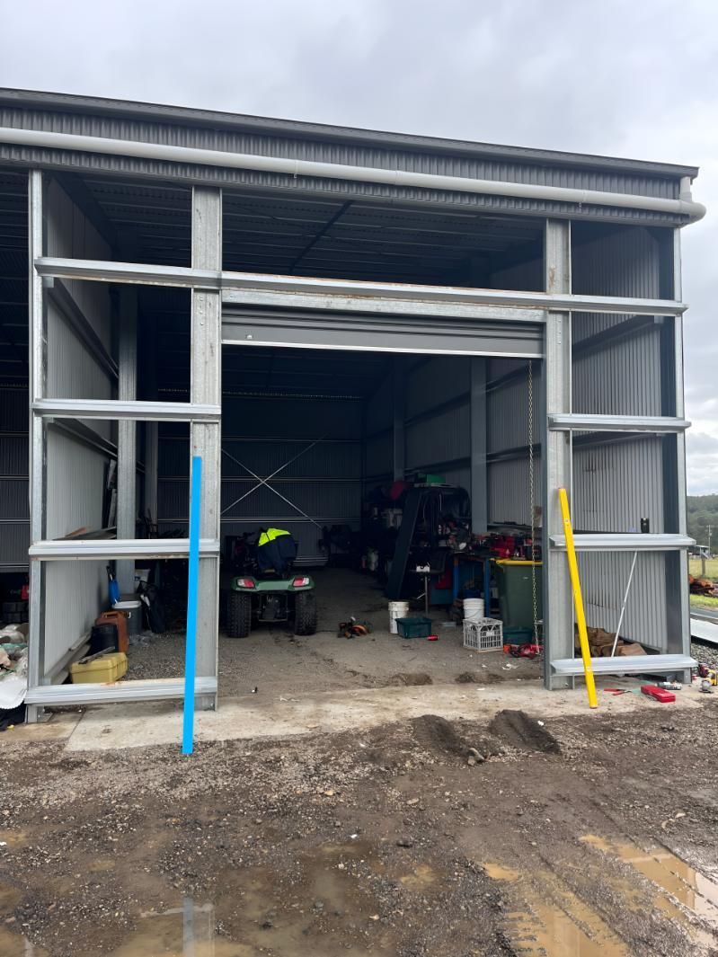 Garage With a Sliding Door That is Open — TM Built Construction In Singleton, NSW