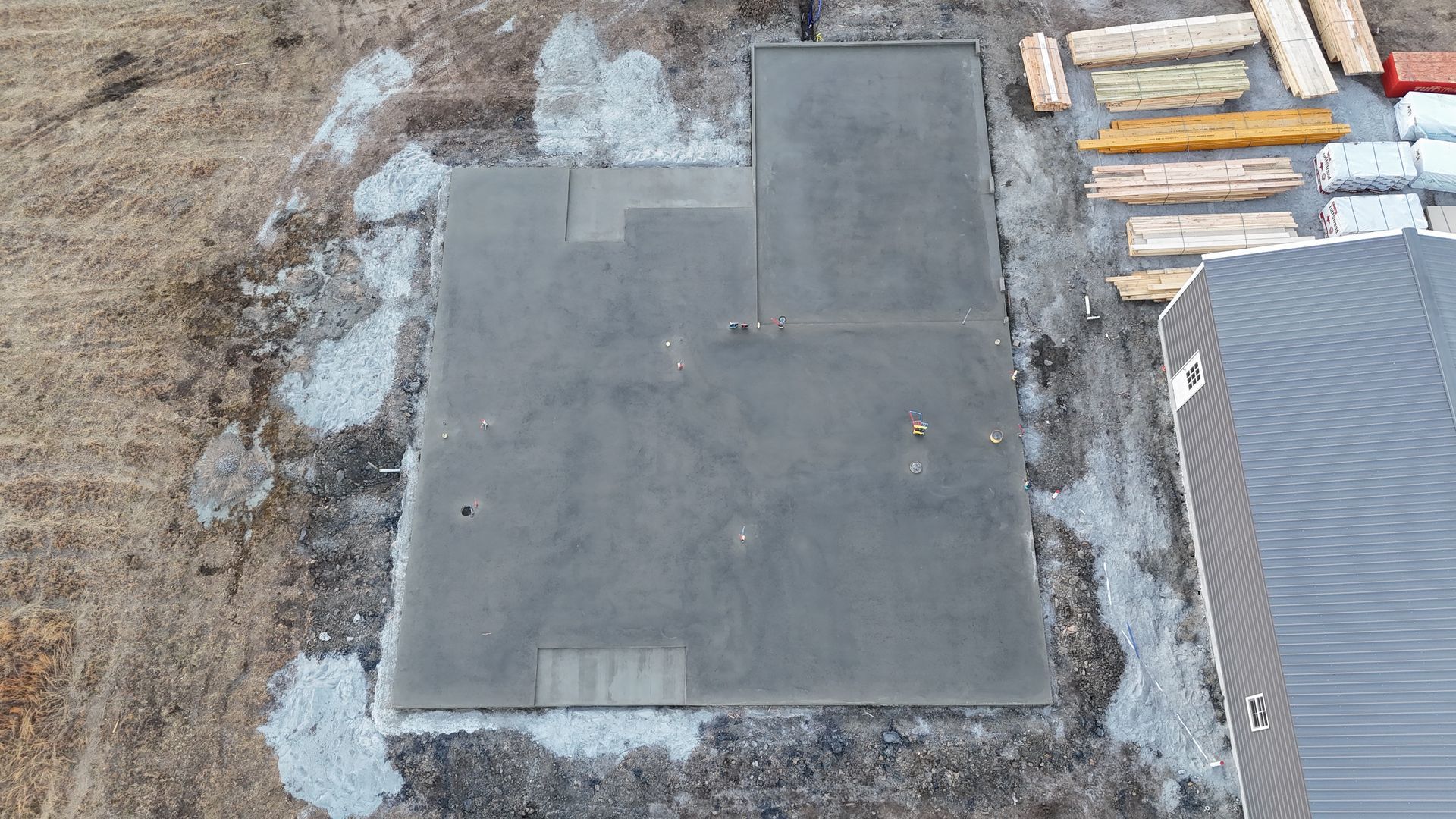 A mobile home with a concrete patio in front of it.